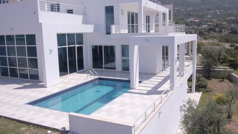 Aerial view of construction of modern villas with swimming pools.
 : vidéo de stock