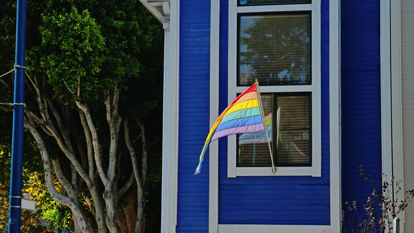 SAN FRANCISCO - Circa October, 2015 - A gay pride flag flies outside a residence near the Castro District in San Francisco.  	