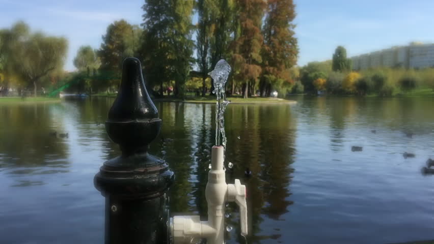 Water from a public water fountain, in slow motion, romantic effect. Video was made in autumn, in a beautiful sunny day, in october 2015