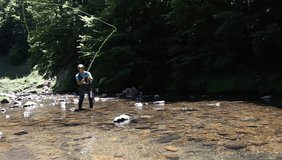 Man flyfishing in river