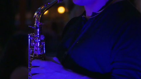 Man Playing Saxophone in Public at Night Close Up