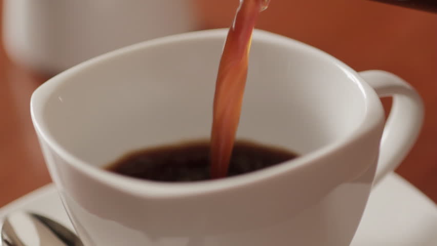 Sequence of pouring a cup of coffee and then pouring in milk. Both shots from