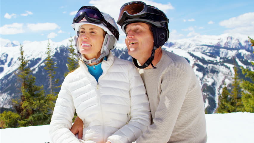 Caucasian couple American male female outdoor winter ski snow environment leisure lifestyle active togetherness happy travel RED DRAGON