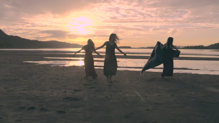 3 Friends Dance And Twirl In Circles Around Beach At Sunset (Slow Motion) | Shutterstock HD Video #12332504