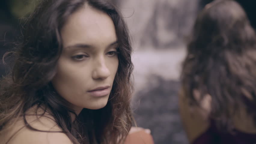 Portrait Of Young Woman, She Looks Around, Her Friend Watches Waterfall (Slow Motion)