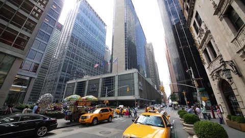 NYC - AUG 24, 2014: Taxi on road and skyscrapers. New York has second highest number of skyscrapers