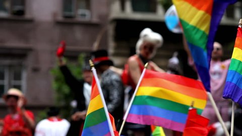 NEW YORK CITY - JUNE 26: Drag  Queens and Gay Pride Rainbow Flag waving at NYC Gay Pride Parade, June 26, 2011, New York City.