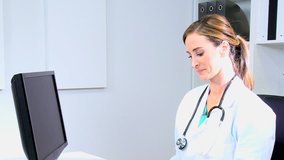 Western European American male female medical doctor executive health planning computer technology x-ray records team meeting - Powered by Shutterstock - Get 15% off with code: PIKWIZARD15