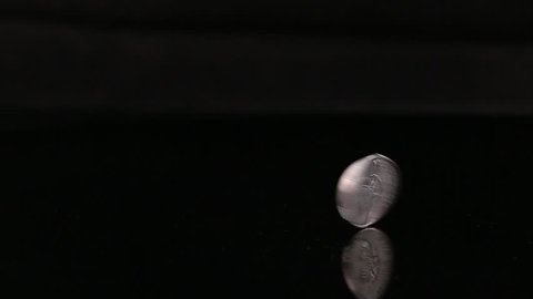 Spinning Flipping Money Coin Isolated On Black Background