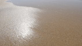 Sea waves spreading summer background close-up slow motion 1920X1080 FullHD footage  - Sparkling shallow ocean water on fine beach sand slow-mo 1080p HD video