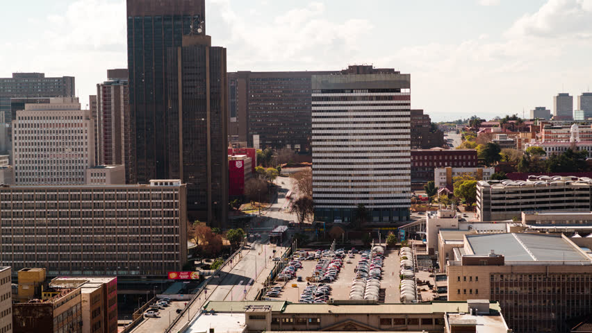 A slow panning timelapse across the city centre of Johannesburg (CBD) in the daytime showing Park Station, Gautrain, Constitution Hill(Johannesburg, Gauteng, South Africa - 25/07/2015)