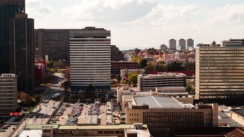 A slow panning timelapse across the city centre of Johannesburg (CBD) in the daytime showing Park Station, Gautrain, Constitution Hill(Johannesburg, Gauteng, South Africa - 25/07/2015)