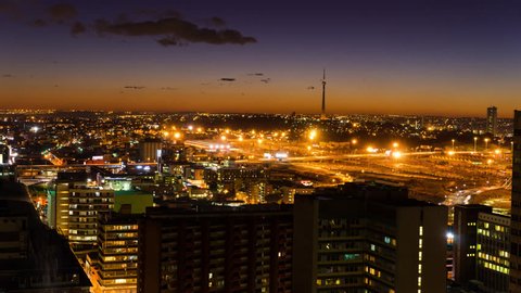 A night timelapse of the city centre of Johannesburg (CBD) at nightfall in peak traffic showing the Sentech Tower in the Braamfontein, New Town areaJohannesburg, Gauteng, South Africa - 25/07/2015)