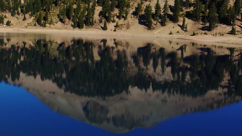 Lake Helen reflects the summit of Lassen Peak in Lassen Volcanic National Park, Northern California.