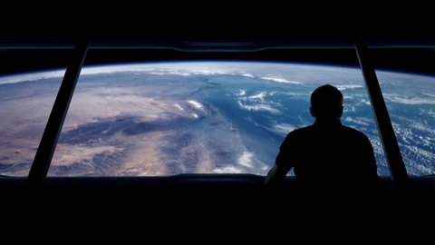 Astronaut Looks Out At Earth From Orbit
