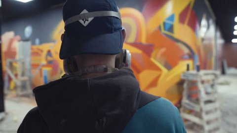 Graffiti Artist Watching At His Work