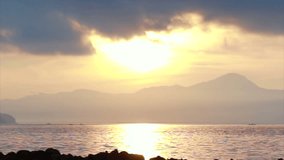Video of golden sunrise above the Andaman ocean sea with island and seascape