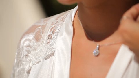 Pendant with diamonds for the bride, wedding on the island of Santorini