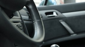 Details inside car interior with slow tilting 4K 2160p 30fps  UltraHD footage - Gear shift stick steering wheel inside vehicle tilt 4K 3840X2160 UHD video