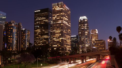 LOS ANGELES, CA, USA - APR17, 2015: 4K Time lapse rush hour traffic downtown Los Angeles skyline at sunset and twilight