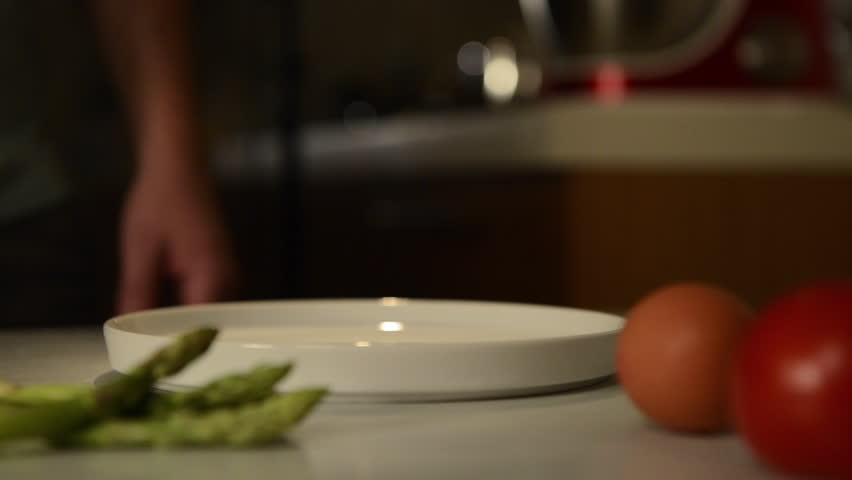 preparation of an eggs benedict plate Royalty-Free Stock Footage #12404222