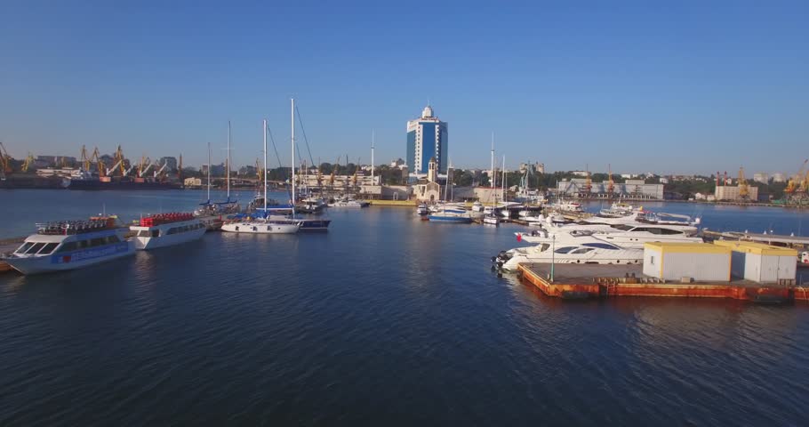 City port on sunrise. Urban aerial view. Odessa Marine Trade Port  is one of the largest ports in the Black Sea basin. Drone footage. 4K.