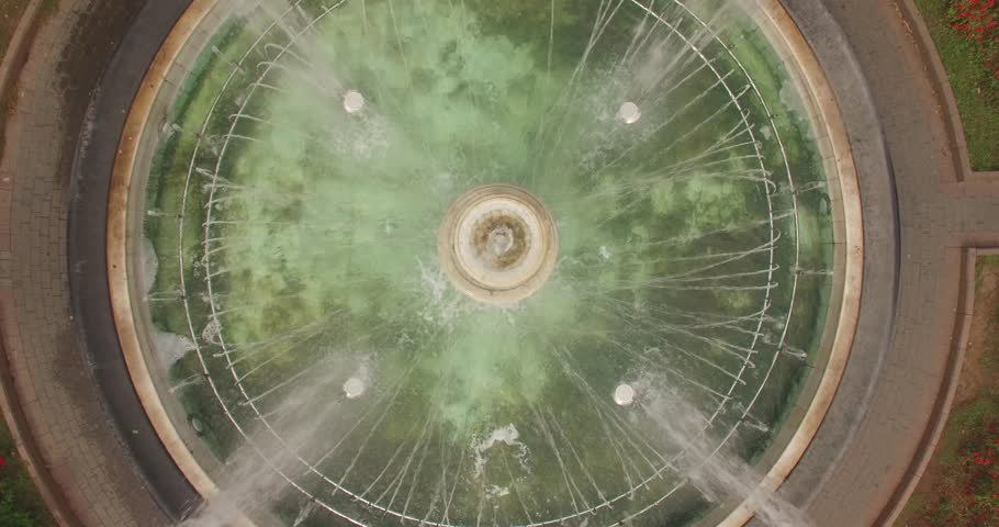 Round fountain in city garden. Odessa, Ukraine. Aerial, 4K. 