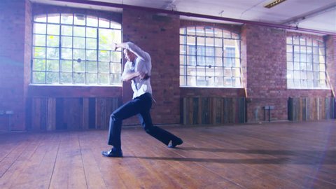 4K Young Asian martial artist training alone, practising his moves with a shaolin whip chain. Shot on RED Epic.