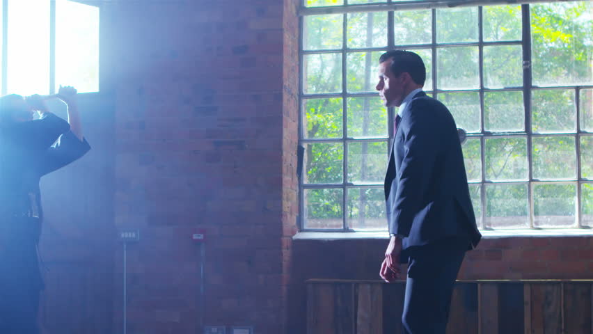 4K Handsome businessman escapes an attack by Japanese kendo fighter. Shot on RED Epic.