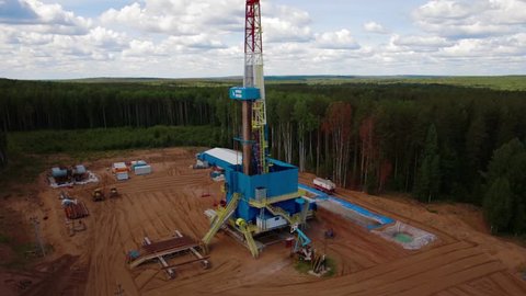 Aerial view of the oil gas drilling tower in forest