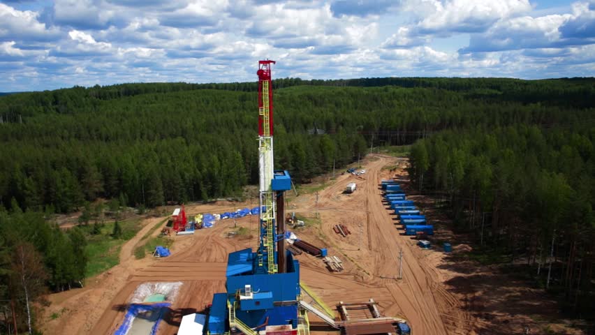 Aerial view of the oil gas drilling tower in forest Royalty-Free Stock Footage #12436247