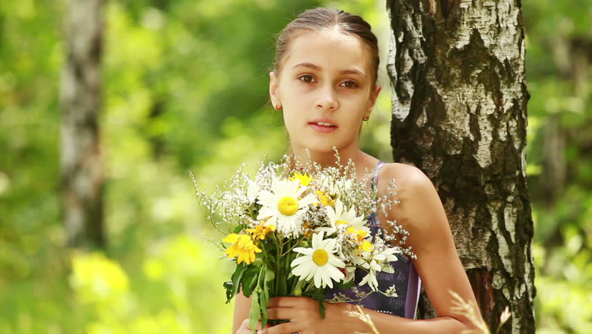 Portrait of girl with flowers. Static. 