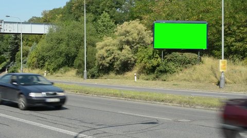 billboard by the busy road in the suburb - green screen