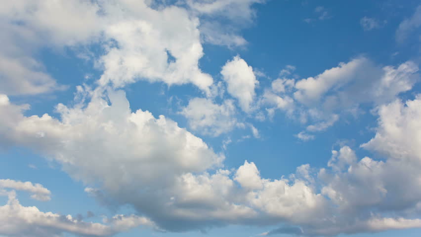 Summer Clouds fly across a royal blue sky. HD 1080p timelapse.