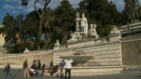 Glidecam Piazza Del Popolo Fountain (2) With Tourists. Rome, Italy. 2011