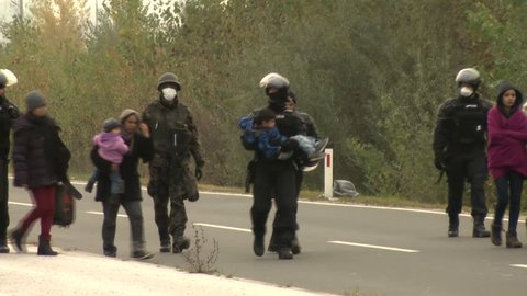 Dramatic video from the Slovene refugee crisis.
The police officer help for the little refugees boy on the long walking.
25.10.2015 Slovenia , Dobova