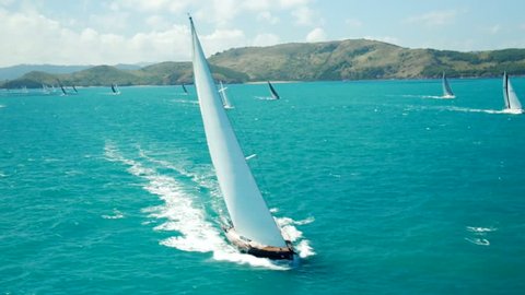 Aerial of yacht sailing amongst islands
