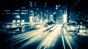 Abstract blurred video of night city traffic across street. Time lapse. Hong Kong