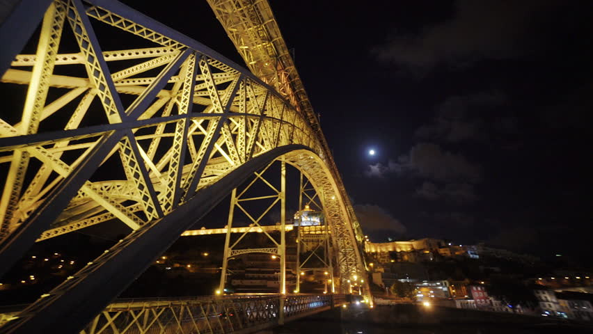 The bridge above the Alegre River is illuminated at night in Porto. Porto, Portugal - July, 2015