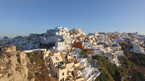 Aerial view flying over city of OIa on Santorini Greece 4K
