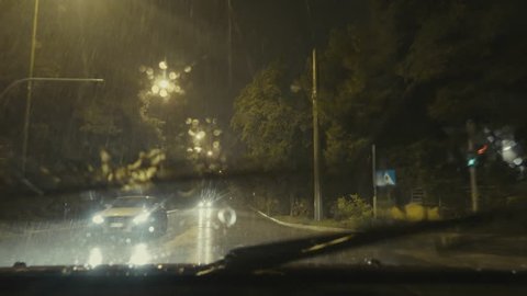 4K driving pov,downtown avenues, night,rain.4K series of driving point of view clips in various streets and locations in the rain.Look below for more shots.Commercial,no logos,licence plates visible.