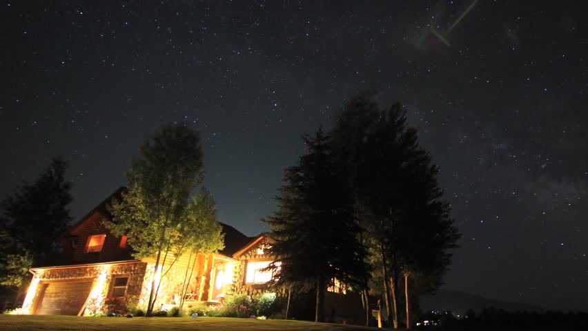 A star timelapse over a ranch house