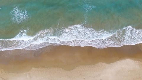 Aerial footage of Tropical Sandy beach with waves breaking on shore Stock Video