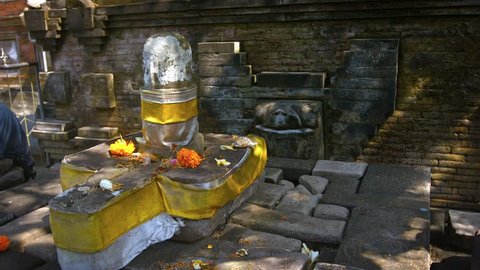 Decorated altar of worship to the Hindu god. Shiva. with offerings of flowers at Tirta Empul temple in bali. Indonesia. Video 1920x1080