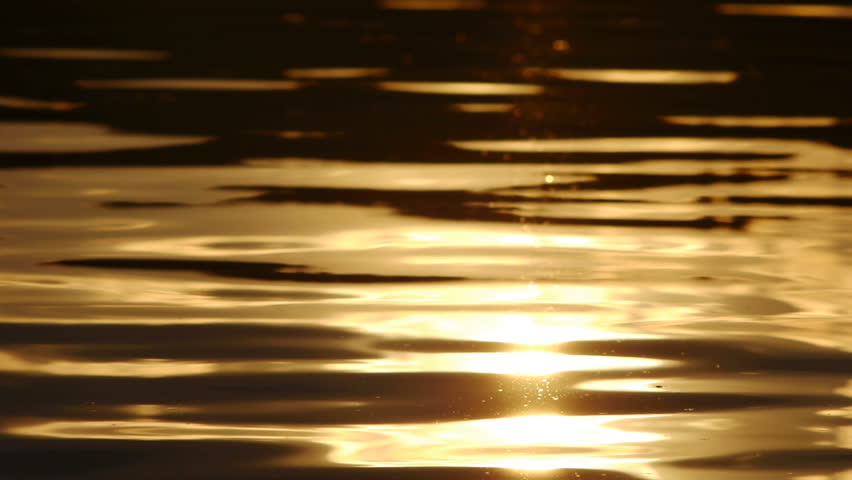 lake water with golden sunset reflection