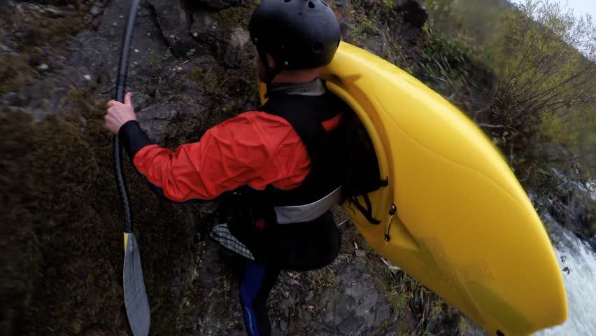 Kayaker Portaging while wearing 360 degree spinning camera