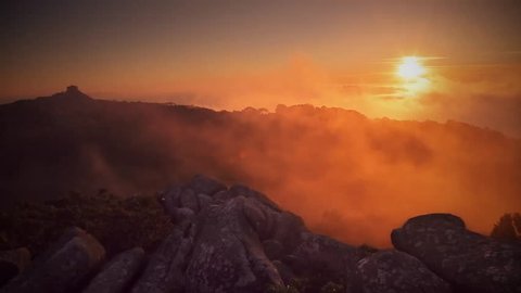 Cinemagraph Loop - Clouds move passed the sun and through forest - motion photo