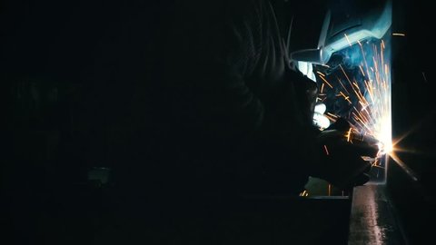 Cinemagraph Loop - Man welds metal together - motion photo