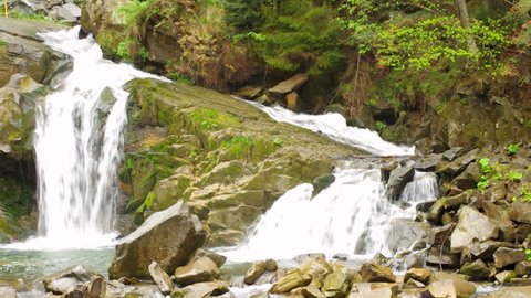 Beautiful waterfall in mountain forest