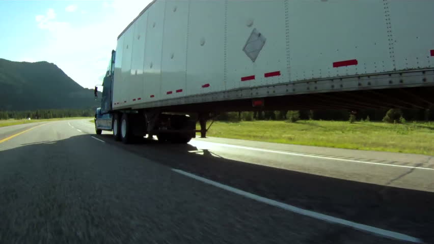 Vehicle pov shot of semi trailer truck traffic on highway Royalty-Free Stock Footage #1253650